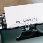Typewriter with paper and text "Be Amazing".